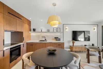 a kitchen and dining room with a table and chairs at REF 2030 - Cannes Croisette - Sea view apartment for rent in Cannes
