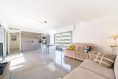 a living room with a couch and a table at Brand new 2 bedrooms heart of Cannes in Cannes