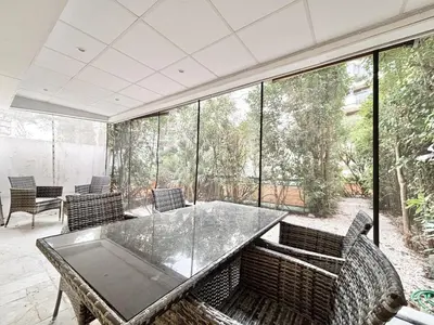 a dining room with a glass table and chairs at Cannes one bedroom apartment - 8D1 in Cannes