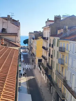 a view of a city street with buildings at Vue mer 50 m plage et Croisette Cannes centre in Cannes