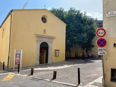 a yellow building with a church with a round doorway at Cosy & modern 1 Bedroom Forville old town 207 in Cannes