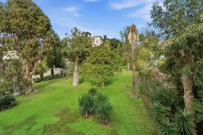 an aerial view of a garden with a house in the background at La Rose des Vents - Cannes in Cannes