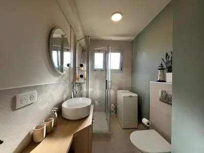 a bathroom with a sink and a toilet and a shower at Riva in Cannes