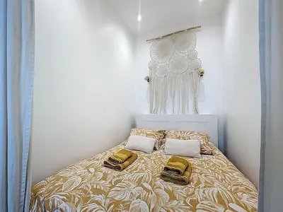 a bedroom with a bed with two pillows on it at 42 m2 - Close to Palais des Festivals and beaches in Cannes