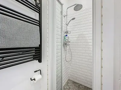 a shower with a glass door in a bathroom at 42 m2 - Close to Palais des Festivals and beaches in Cannes