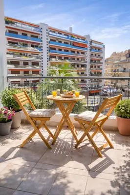 a table and two chairs sitting on a balcony at Carlton in Cannes