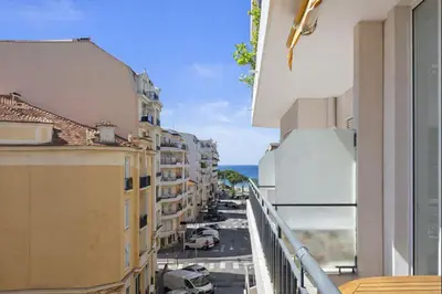 a view of a city street from a balcony at Carlton in Cannes