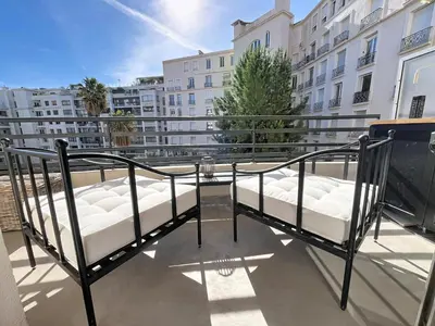 a balcony with two beds on top of a building at Beautifull studio with balcony Rouaze Miramar 120 in Cannes