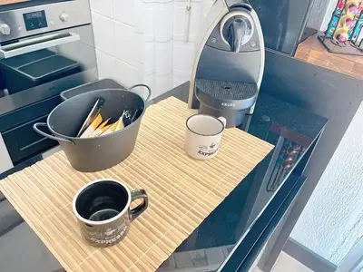 a kitchen counter with a mixer and a cup of coffee at Beautifull studio with balcony Rouaze Miramar 120 in Cannes