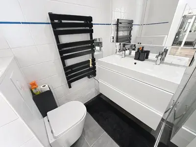 a white bathroom with a toilet and a sink at Beautifull studio with balcony Rouaze Miramar 120 in Cannes