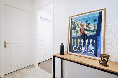 a painting of a woman on a dresser in a room at 2 Bedrooms Apartment-Cannes Center Suquet-2mins to Beach & 10mins to Palais-AirConditioning & FiberWifi in Cannes