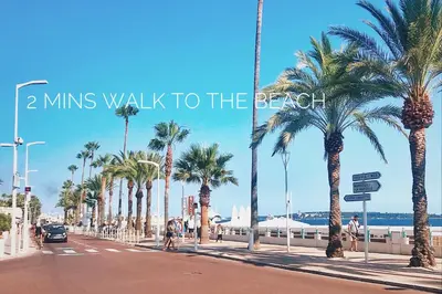 a street with palm trees and the words mins walk to the beach at 2 Bedrooms Apartment-Cannes Center Suquet-2mins to Beach & 10mins to Palais-AirConditioning & FiberWifi in Cannes