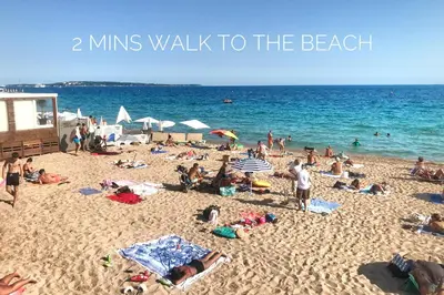a group of people on a beach with the words mins walk to the beach at 2 Bedrooms Apartment-Cannes Center Suquet-2mins to Beach & 10mins to Palais-AirConditioning & FiberWifi in Cannes