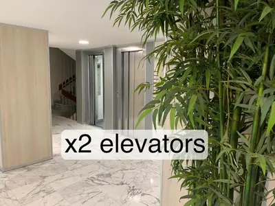 a room with plants and the words elevators at 69m2, balcon vue mer, 2 salles de bain in Cannes