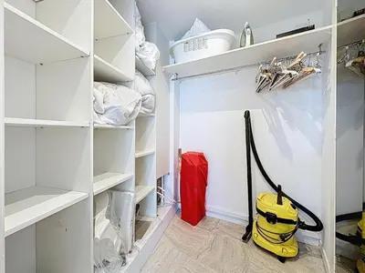 a walk in pantry with a yellow vacuum cleaner at 69m2, balcon vue mer, 2 salles de bain in Cannes
