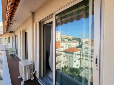 a balcony with a view of a city at 69m2, balcon vue mer, 2 salles de bain in Cannes