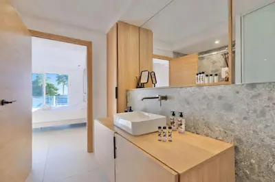 a bathroom with a sink and a counter with a sink at Prestige Croisette - Apartment with Panoramic Terrace and Sea View in Cannes in Cannes