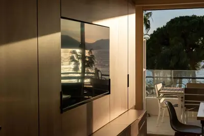 a view of a balcony from a house with a window at Prestige Croisette - Apartment with Panoramic Terrace and Sea View in Cannes in Cannes
