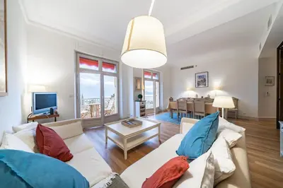 a living room with a couch and a table at COZYSTAY Elegant Two-Bedroom Apartment in the 