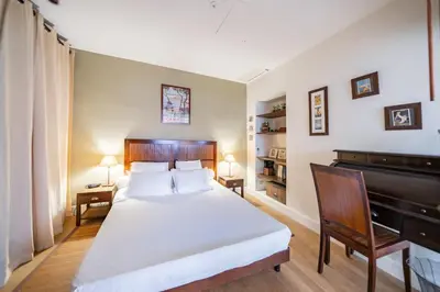 a bedroom with a bed and a piano at COZYSTAY Elegant Two-Bedroom Apartment in the 