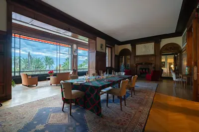 a dining room with a long table and chairs at COZYSTAY Elegant Two-Bedroom Apartment in the 