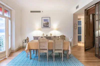 a dining room with a table and chairs at COZYSTAY Elegant Two-Bedroom Apartment in the 
