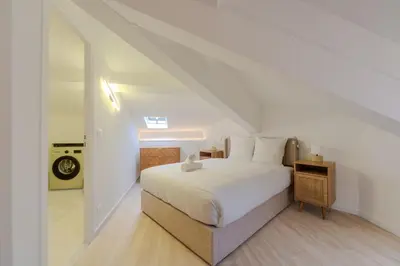 a roll of toilet paper sitting on top of a bed at Cannes Centre - Palais a pied - Appartement Prestige 3 chambres et studio - 8 pers in Cannes