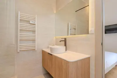 a large closet with two doors in a bedroom at Cannes Centre - Palais a pied - Appartement Prestige 3 chambres et studio - 8 pers in Cannes