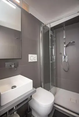 a bathroom with a sink and a toilet and a shower at Cannes Marina by Connexion in Cannes