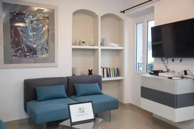 a living room with a couch and a tv at Cannes Marina by Connexion in Cannes