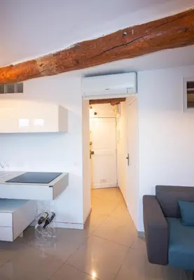 a living room with a couch and a table at Cannes Marina by Connexion in Cannes
