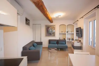 a living room with two couches and a tv at Cannes Marina by Connexion in Cannes