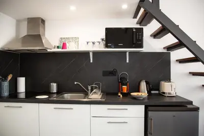 a kitchen with a sink and a counter top at Sweet Holiday in Cannes