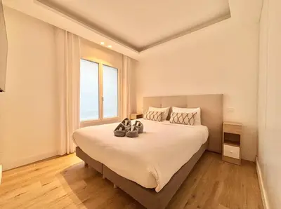 a bedroom with a large bed with shoes on it at Cannes 2x2 bedrooms apartment - 24P3 in Cannes