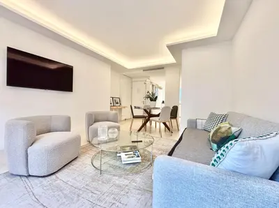 a living room with a couch and two chairs and a table at Cannes 2x2 bedrooms apartment - 24P3 in Cannes