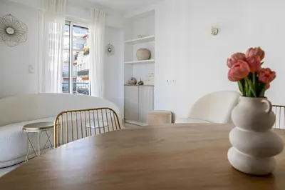 a table with a vase of flowers on top of it at Splendid apartment a-c 2BR-4P - Sea View in Cannes