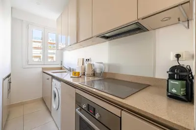 a kitchen with a sink and a counter top at Splendid apartment a-c 2BR-4P - Sea View in Cannes