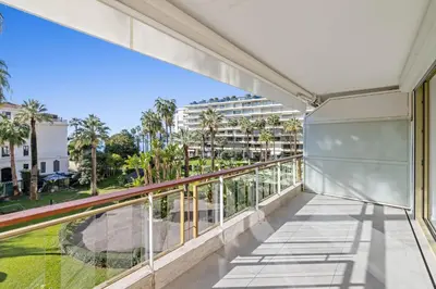 a balcony with a view of a building at REF 2042 - Cannes Croisette - Apartment for rent in Cannes