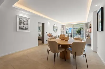 a dining room with a table and chairs at REF 2042 - Cannes Croisette - Apartment for rent in Cannes
