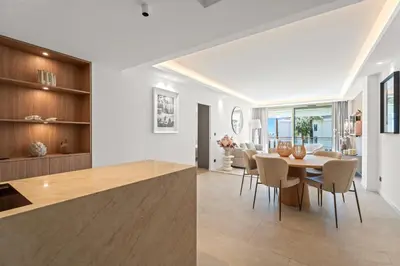 a kitchen and dining room with a table and chairs at REF 2042 - Cannes Croisette - Apartment for rent in Cannes