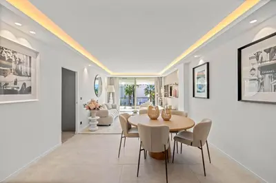 a dining room with a table and chairs at REF 2042 - Cannes Croisette - Apartment for rent in Cannes