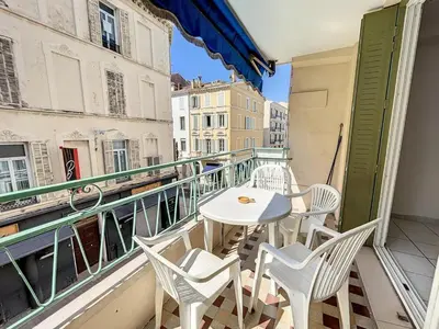 a balcony with a table and chairs on a building at 2 bedroom Pradignac 305 in Cannes