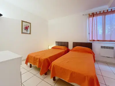 two beds sitting next to each other in a room at 2 bedroom Pradignac 305 in Cannes