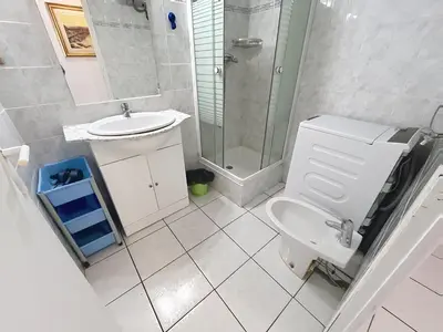 a bathroom with a toilet and a sink and a shower at 2 bedroom Pradignac 305 in Cannes