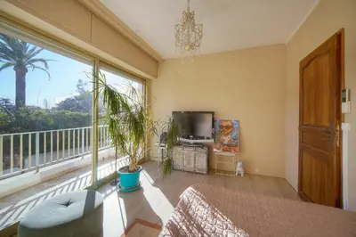 a balcony with white chairs and a view of a city at FRGK Luxury Private Villa for MIPIM 4 Bedrooms Pool Garden Parking Cannes in Cannes