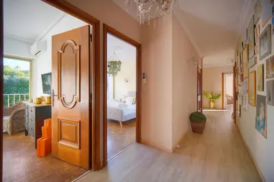 a vase sitting on a wooden table with two stools at FRGK Luxury Private Villa for MIPIM 4 Bedrooms Pool Garden Parking Cannes in Cannes