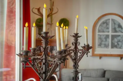 a group of candles on a candlestick in a room at 6Bedroom Duplex with Sauna, AC Wi-Fi Central Cannes in Cannes
