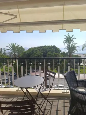 a table and chairs on a balcony with a view at Viva Riviera Studio Croisette Terrace Sea View in Cannes
