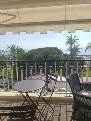 a table and chairs on a balcony with a view at Viva Riviera Studio Croisette Terrace Sea View in Cannes