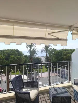 a balcony with chairs and a view of a parking lot at Viva Riviera Studio Croisette Terrace Sea View in Cannes